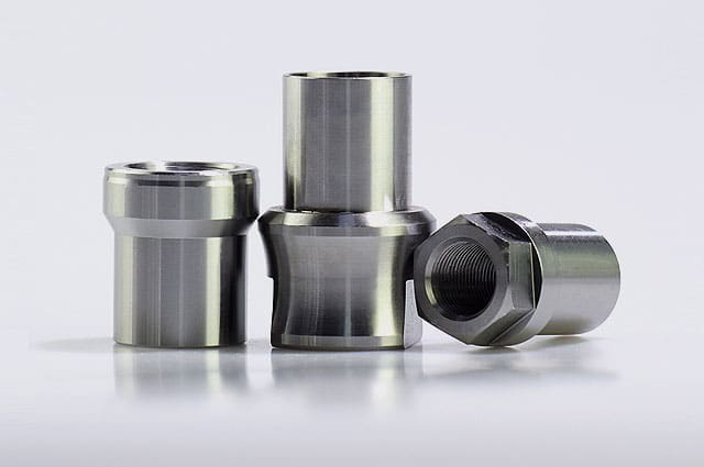 Titanium weld-in bungs for custom fabrication